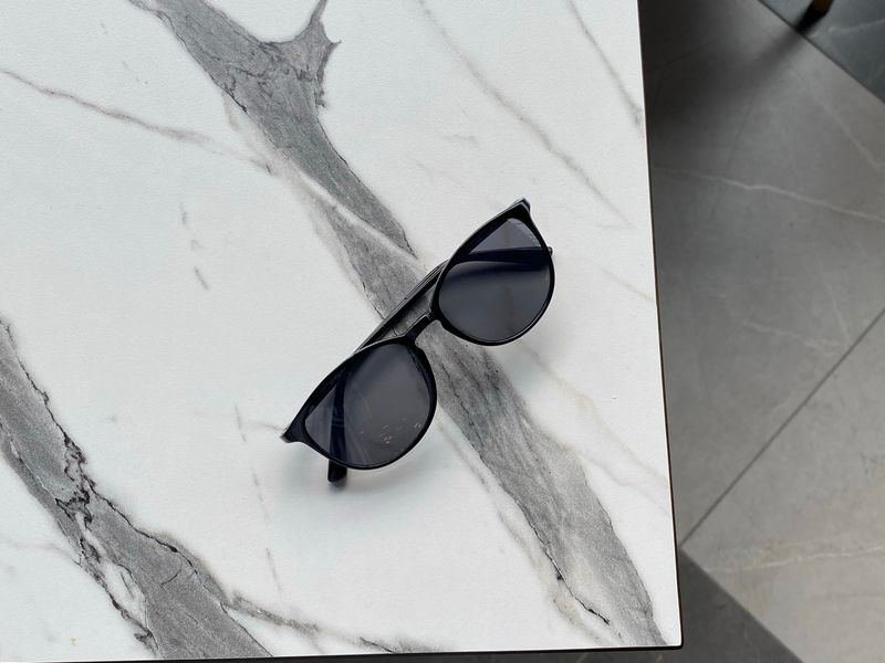 Sleek sunglasses resting on a marble surface